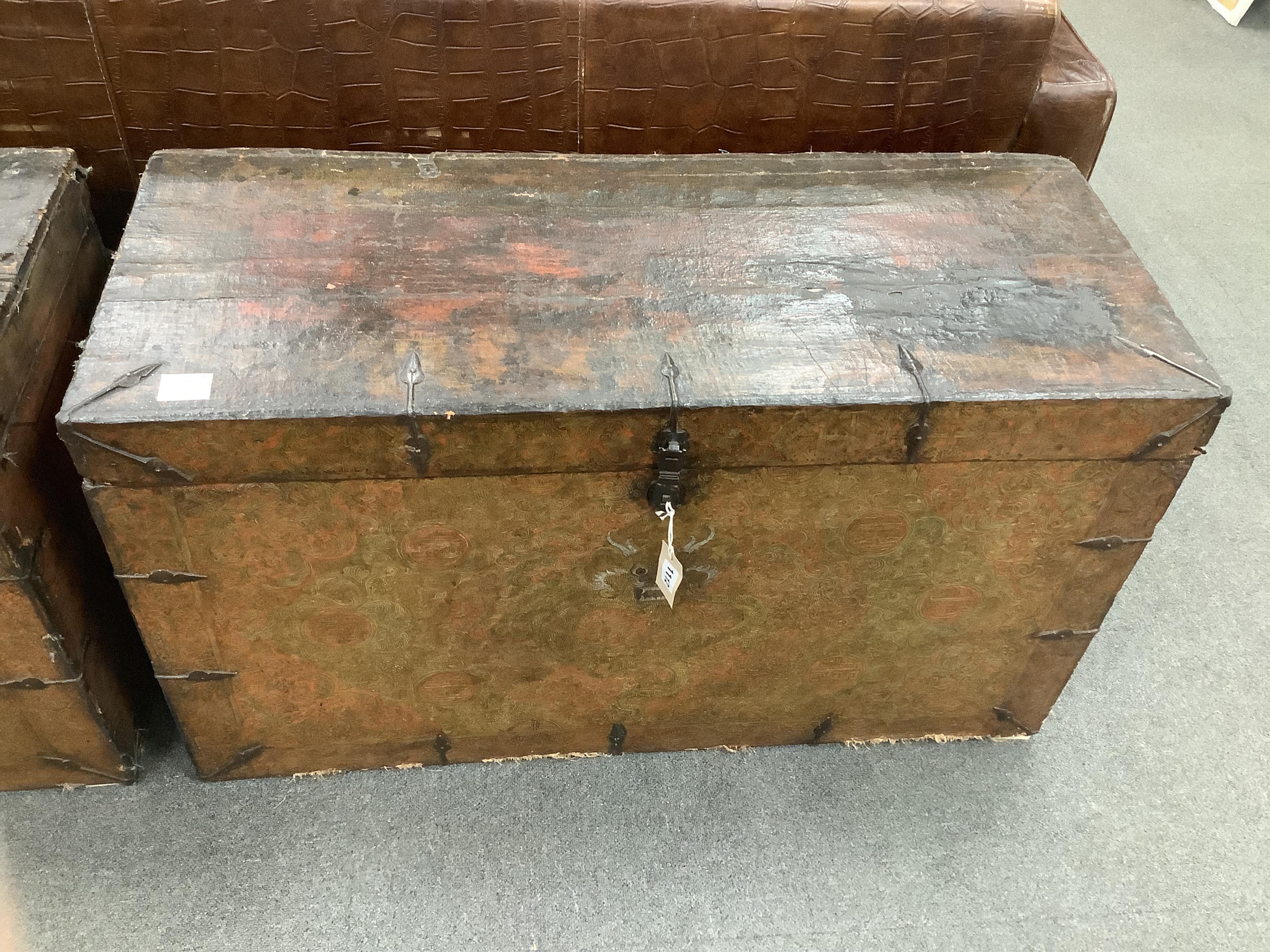 A pair of early 19th century Tibetan trunks, width 100cm, depth 42cm, height 57cm. Condition - poor